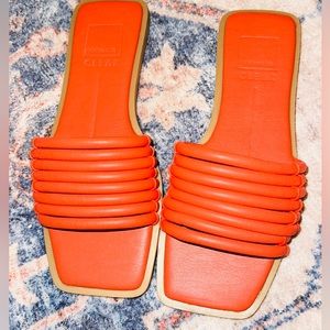 Orange Dolce Vita flat sandals